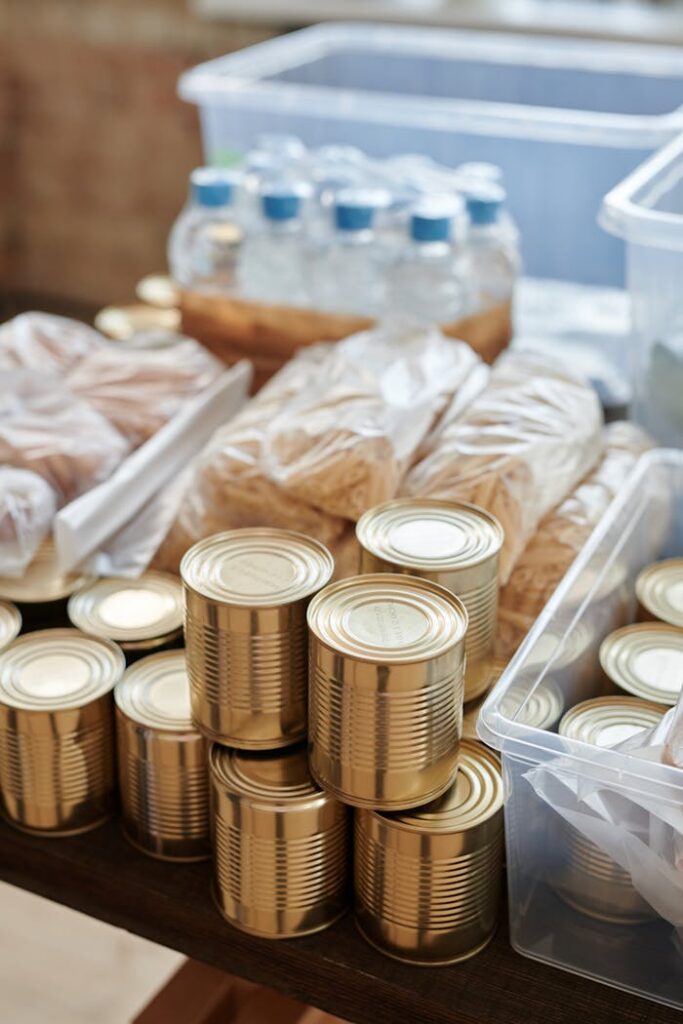 The Art of Drawing Readers In: Your attractive post title goes here A variety of canned goods and packaged items arranged for a donation drive or food bank collection.